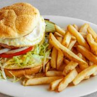 Farmers Burger · Grilled beef patty topped with it all! Ham, bacon, Cheddar cheese and fried egg. Lettuce, on...