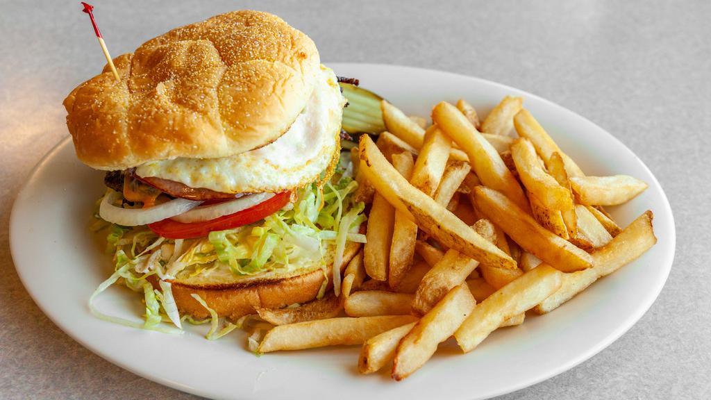 Farmers Burger · Grilled beef patty topped with it all! Ham, bacon, Cheddar cheese and fried egg. Lettuce, onion, tomato and mayo on a grilled Kaiser bun.