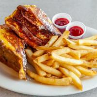 Monte Cristo Sandwich · Turkey, ham, Swiss and Cheddar cheese layered between egg bread. Dipped in egg batter and gr...