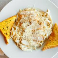Fettuccini Alfredo · Classic fettuccini noodles mixed with a homemade garlic Parmesan sauce.