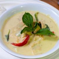 Green Curry · Green curry paste mixed with coconut milk, bamboo shoots, bell pepper and basil leaf.