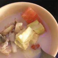 Tom Kha Chicken · Coconut and galangal soup with kaffir lime leaves, lemongrass, mushrooms, cabbage and tomato...