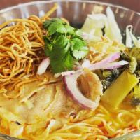 Khao Soy Chicken · Spicy. Noodle in curry northern thai style with chicken thigh, cabbage, red onions, pickles ...
