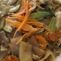 Pad Kee Mao (Drunken Noodles) · Gluten free. Wide rice noodle stir fried with broccoli, carrots, onions, bell peppers, garli...