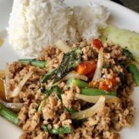 Pad Kra Pao · Spicy. Choice of protein, bell peppers, green beans, onions, garlic and thai holy basil. Add...