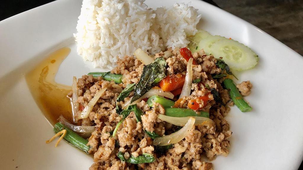 Pad Kra Pao · Spicy. Choice of protein, bell peppers, green beans, onions, garlic and thai holy basil. Add fried egg for an additional charge. Served with a side of jasmine rice.