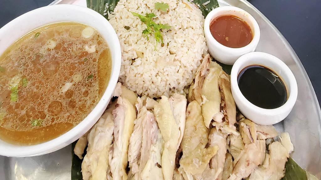 Khao Mun Gai · Special house recipe rice with ginger with chicken dark meat or crispy chicken. Serve with special sauce and side of soup.
