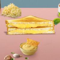 Classic Grilled Cheese · Melted American cheese between two slices of buttery grilled bread.