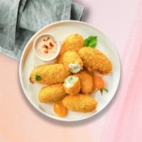 Jalapeno Poppers · Fresh jalapenos coated in cream cheese and fried until golden brown