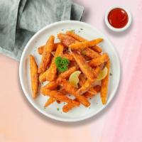 Sweet Potato Fries · Thick-cut sweet potato wedges with salt.