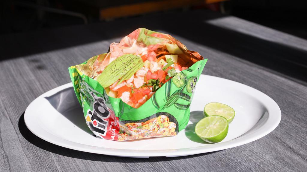 Tosti-Camaron · Served in its own bag with shrimp, cucumber, tomato, cilantro, onion, avocado, and prepared clamato. Dairy-free.