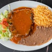 Rib Platter · House Specialty. Smothered with Spicy Rib Sauce with Rice, Beans, Garnish and 2 Tortillas.