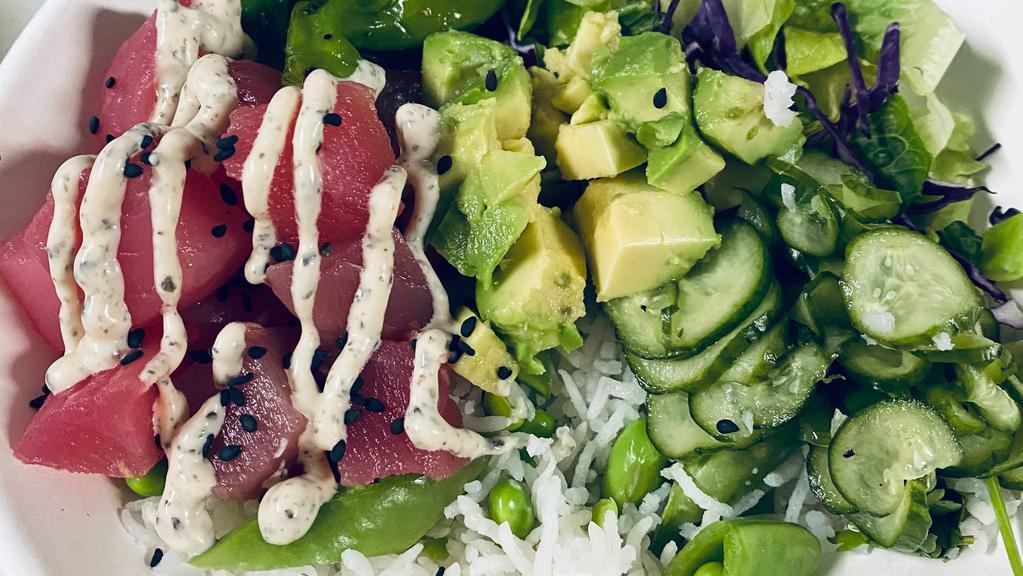 Buddha Bowl Or Wrap · Tuna Poke, Romaine & Cabbage Slaw, Edamame & Snap Pea Basmati Rice, Shishito Peppers, Cucumber Salad, Avocado, Miso Vinaigrette, and Nori Aioli (with tuna only). Vegan: Sub for Tofu