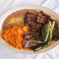 Carne Asada · Choice of corn or flour tortillas, comes with rice and beans, fried jalapenos and fried onio...