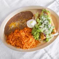Taquitos Plate · 3 fried taquitos made with chicken, comes with rice, beans, guacamole, lettuce, and cotija c...