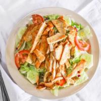 Chicken Salad · Green Salad with chicken Breast, along with cheese, tomatoes, and cucumbers.