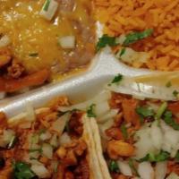 2 Grilled Chicken Tacos Plate · 2 tacos with rice and beans, onions and cilantro