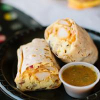 Breakfast Burrito · Cheese, mushrooms, onions, tomatoes, and potatoes. Choice of meat.