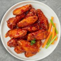 Clovin' Buffalo Wings · Breaded or naked fresh chicken wings, fried until golden brown, and tossed in garlic and buf...
