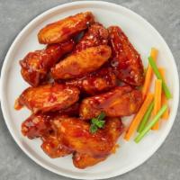 Flaming Buffalo Wings · Breaded or naked fresh chicken wings, fried until golden brown, and tossed in buffalo sauce....