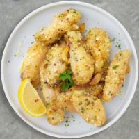Cheesy Garlic Tricks Wings (Boneless) · Boneless breaded fresh chicken wings, fried until golden brown, and tossed in garlic and par...