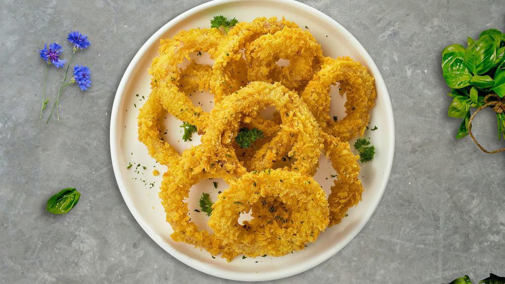 On And Onion Rings · Sliced onions dipped in a light batter and fried until crispy and golden brown.