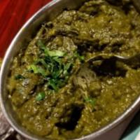 Saag Paneer · Spinach cooked with homemade soft cheese, onions, garlic, ginger, cream and spices. Served w...