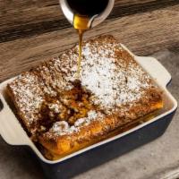 Baked Creme Brûlée French Toast · Egg brioche soaked in crème brulee custard base, topped with cinnamon crumble. Optional incl...
