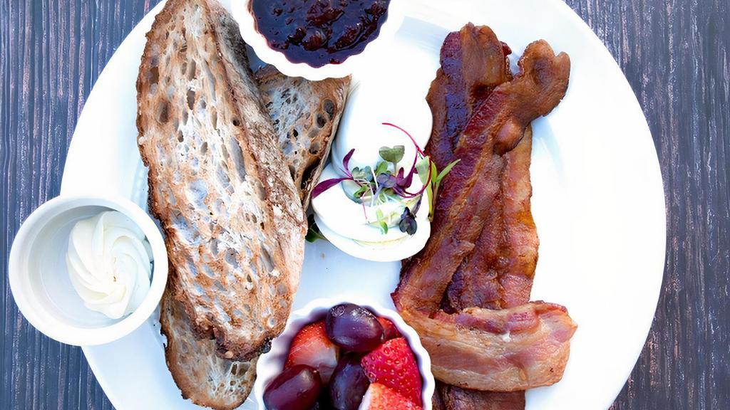 Breakfast Plate · Applewood smoked bacon, turkey breast, ham, or salmon. Choice of toast, biscuit or croissant & jam. With hardboiled eggs and fruit.