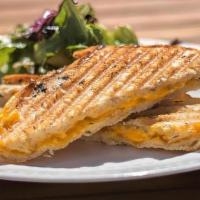 Vegan Grilled Cheese Panini · Vegan cheddar on crispy sourdough bread brushed with herbs and olive oil. Served with choice...