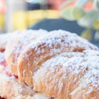 Strawberry Croissant · Fresh baked croissant stuffed with fresh strawberries and cream cheese blend filling. Dusted...