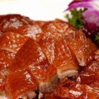 Roasted Duck (Half) · Duck Roasted with tradition Peking Style, sliced and served with Buns.