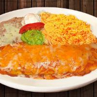 Burrito Plate · Filled with meat choice, beans, onions, cilantro, salsa, jack cheese. Topped with enchilada ...