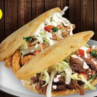 Combo #66 Two Gorditas · Two thick handmade tortilla filled with refried beans, with meat choice, onions cilantro, sa...