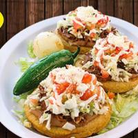 Combo #69 Three Sopitos · Three thick handmade corn tortillas spread with beans and topped with meat of your choice, o...