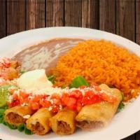 Taquitos Rancheros · Crisp corn tortillas filled with spicy shredded beef or shredded chicken, garnished with gua...