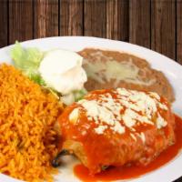 Poblano Chile Relleno · Roasted pasilla pepper and filled with Mexican cheese. Cover with tomato sauce. Garnished wi...