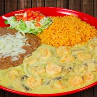 Camarones A La Crema · Prawns sautéed with mushrooms and onions in a delicious Mexican cheese cream sauce. Garnishe...