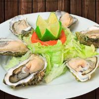 Ostiones En Su Concha · Oysters in their shell with lime. Baked. Consuming raw or undercooked meats, poultry, seafoo...