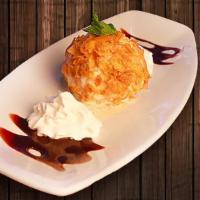 Fried Ice Cream · A breaded scoop of vanilla ice cream, quickly deep-fried, served with chocolate sauce, whipp...