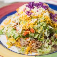Flying Saucer · Beef, pork or chicken with beans, lettuce, cheese, sour cream, guacamole & salsa fresca - Al...
