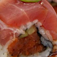 Fleury Fire Roll · Spicy tuna roll covered in sashimi grade ahi, unagi sauce, garlic ponzu, jalapeno and srirac...