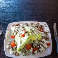 Tru Wedge Salad · Two crisp wedges of iceberg drizzled with our blue cheese dressing. Topped with blue cheese ...