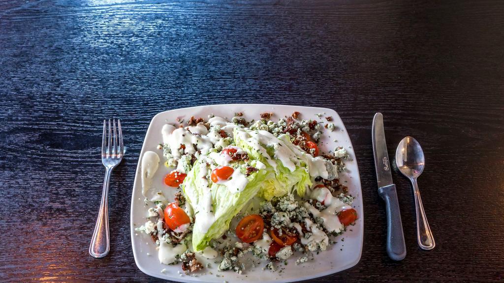 Tru Wedge Salad · Two crisp wedges of iceberg drizzled with our blue cheese dressing. Topped with blue cheese crumbles, crispy apple smoked bacon, and diced tomatoes.