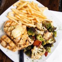 Grilled Chicken And Fries · Paillard style grilled chicken topped with lemon herb butter. Served with a side of skinny f...