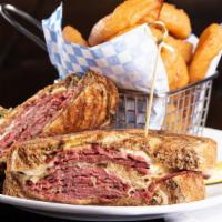 Hot Pastrami Sandwich · Spicy. Warm pastrami and melted Swiss cheese topped with sauerkraut and mustard on marble ry...