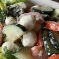 Athenian Salad Large · Cucumbers, Roma tomatoes, fresh basil, fresh mozzarella, tossed in our basil vinaigrette and...