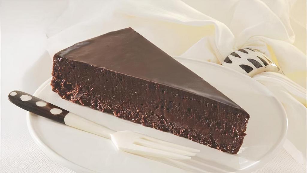 Flourless Chocolate Torte (Gluten-Free) · A gluten-free slice of heaven made from four different types of chocolate and topped with a silky chocolate ganache.