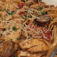 Cajun Fettuccine · Fettuccine, chicken, sausage, onions, and prawns sauteed in house-made spicy cajun alfredo s...