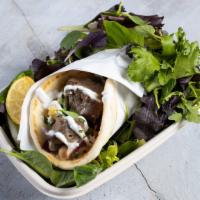 The Genie'S Gyro · Doner style lamb served in hot pita bread. Served with Tomatoes, lettuce onions, green peppe...